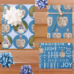 Dreidel Rustic Oak Cute Blue Photo Hanukkah Wrapping Paper Sheet<br><div class="desc">Create your own Hanukkah wrapping paper sheets with two personalised designs in the three design assortment. All based around rustic dreidels in a faux oak wood graphic, the first sheet is a series of jumbo dots in rich blue on a background of pale pastel blue. Add your photo into the...</div>