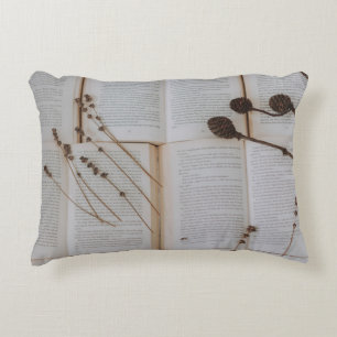 Dried flowers on books decorative cushion