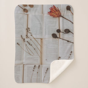 Dried flowers on books sherpa blanket