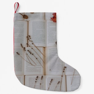 Dried flowers on books small christmas stocking