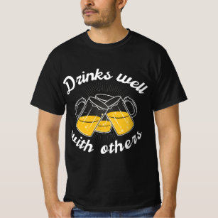 Drinks well with others Men Women T-Shirt