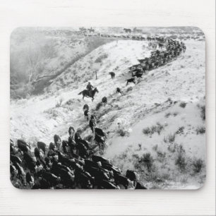 Driving cattle in the winter. mouse mat