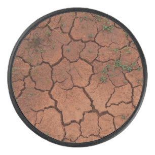 dry, cracked ground hockey puck