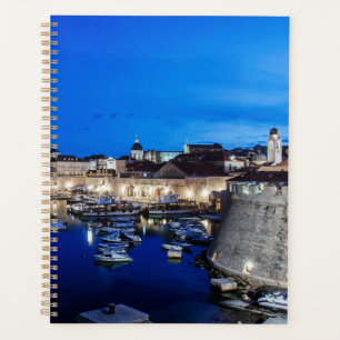 Dubrovnik harbor and walls illuminated at night planner