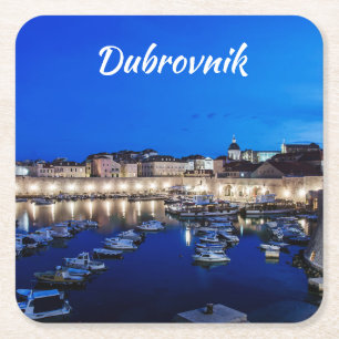 Dubrovnik harbor and walls illuminated at night square paper coaster