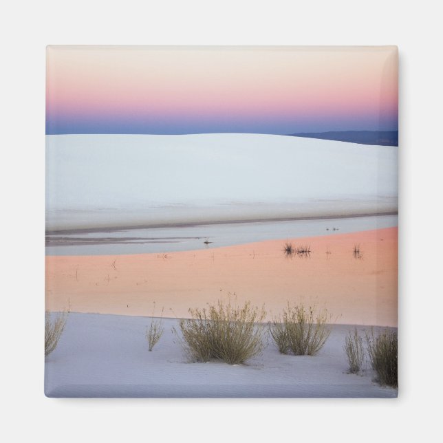 Dusk sky reflected in pool of water from magnet (Front)