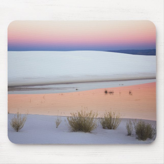 Dusk sky reflected in pool of water from mouse mat (Front)