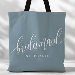 Dusty Blue Bridesmaid Modern Script Tote Bag<br><div class="desc">Show your appreciation to your bridal party with this stylish dusty blue bridesmaid tote bag. Featuring modern script and customisable with your bridesmaid's name, this tote bag is both practical and elegant. The soft colour and chic design make it perfect for carrying wedding day essentials or everyday items. This personalised...</div>