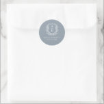 Dusty Blue Crest Modern Monogram Wedding  Classic Round Sticker<br><div class="desc">Add a touch of elegance to your wedding with the Dusty Blue Crest Modern Monogram Wedding Classic Round Sticker. Featuring a soft dusty blue background, a refined crest emblem, and a personalised monogram, this sticker is perfect for enhancing your wedding invitations, favours, or stationery. Its gentle, modern design makes it...</div>