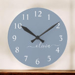 Dusty Blue Minimalist Modern Monogram Elegant  Round Clock<br><div class="desc">Introducing our Dusty Blue Minimalist Modern Monogram Elegant Collection: Elevate your style with understated sophistication and timeless charm. Our collection features minimalist designs in a soothing dusty blue hue, enhanced with elegant monograms tailored to your personal taste. From refined stationery to versatile accessories, each piece in our collection is meticulously...</div>