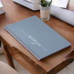 Dusty Blue Modern Script Elegant Monogram Name  Notebook<br><div class="desc">Introducing our Dusty Blue Minimalist Modern Monogram Elegant Collection: Elevate your style with understated sophistication and timeless charm. Our collection features minimalist designs in a soothing dusty blue hue, enhanced with elegant monograms tailored to your personal taste. From refined stationery to versatile accessories, each piece in our collection is meticulously...</div>