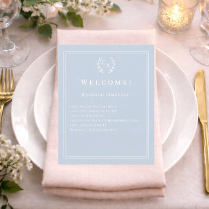 Dusty blue monogrammed wedding program details