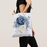 Dusty Blue Navy Champagne Ivory Floral Wedding Tote Bag<br><div class="desc">Dusty blue floral wedding bridesmaid gift bag featuring elegant bouquet of navy blue, royal blue , white , gold, champagne ivory, blush colour rose , ranunculus flower buds and sage green eucalyptus leaves and elegant watercolor bouquet. Please contact me for any help in customisation or if you need any other...</div>