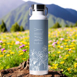 Dusty Blue Wildflower Garden Monogram Name Water Bottle<br><div class="desc">Quench your thirst in style with our exquisite Wildflower Garden Monogram Name Water Bottle. Crafted with durability and elegance in mind, this sleek bottle is adorned with a breathtaking wildflower garden design, evoking the beauty of nature. Personalise your bottle with your monogram and name to make it uniquely yours or...</div>