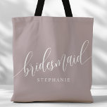 Dusty Lavender Bridesmaid Modern Script Tote Bag<br><div class="desc">Show your appreciation to your bridal party with this stylish dusty lavender purple bridesmaid tote bag. Featuring modern script and customisable with your bridesmaid's name, this tote bag is both practical and elegant. The soft colour and chic design make it perfect for carrying wedding day essentials or everyday items. This...</div>