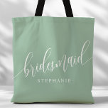 Dusty Mint Bridesmaid Modern Script Tote Bag<br><div class="desc">Show your appreciation to your bridal party with this stylish dusty mint green bridesmaid tote bag. Featuring modern script and customisable with your bridesmaid's name, this tote bag is both practical and elegant. The soft colour and chic design make it perfect for carrying wedding day essentials or everyday items. This...</div>