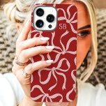 Dusty Red Bow Monogram iPhone 16 Pro Max Case<br><div class="desc">Dress up your phone in style with this chic and trendy dusty red phone case! Featuring a playful pattern of hand-drawn bows and personalised with your monogram, this case is the perfect blend of fashion and function. Made from durable materials to protect your phone from everyday bumps and scratches. A...</div>