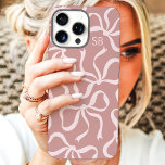Dusty Rose Bow Monogram iPhone 16 Pro Max Case<br><div class="desc">Dress up your phone in style with this chic and trendy dusty rose phone case! Featuring a playful pattern of hand-drawn bows and personalised with your monogram, this case is the perfect blend of fashion and function. Made from durable materials to protect your phone from everyday bumps and scratches. A...</div>