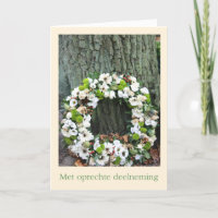 Dutch Sympathy White flower wreath near tree