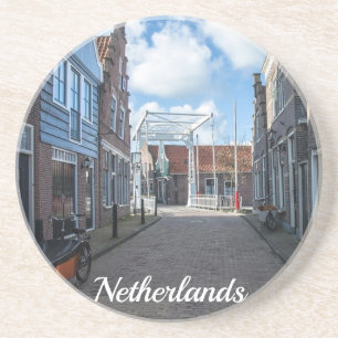 Dutch village with traditional wooden bridge coaster