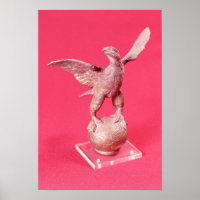 Eagle with spread wings on a ball