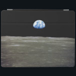 Earth from Moon in Black Space: Earthrise iPad Cover<br><div class="desc">From the desolate lunar plains, Earth hangs like a fragile ornament in the abyss. The stark contrast between the sterile greys of the moonscape and the vibrant blue marble of Earth ignites a pang of foreignness within the moon. Countless nights it had witnessed Earth dominate the sky, a constant companion....</div>