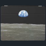 Earth from Moon in Black Space: Earthrise iPad Cover<br><div class="desc">From the desolate lunar plains, Earth hangs like a fragile ornament in the abyss. The stark contrast between the sterile greys of the moonscape and the vibrant blue marble of Earth ignites a pang of foreignness within the moon. Countless nights it had witnessed Earth dominate the sky, a constant companion....</div>