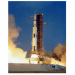 Earth Shakes as Saturn V Blazes Skyward to Moon Standing Photo Sculpture<br><div class="desc">The Earth trembled beneath the colossal thrust of the Saturn V. Buildings swayed precariously as a torrent of flame and fury roared heavenward. The launchpad became a cauldron of churning smoke, momentarily obscuring the behemoth clawing its way towards the inky blackness of space, carrying humanity's dreams on its fiery breath....</div>