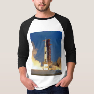 Earth Shakes as Saturn V Blazes Skyward to Moon T-Shirt
