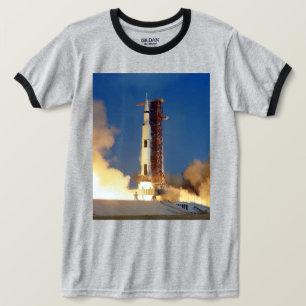 Earth Shakes as Saturn V Blazes Skyward to Moon T-Shirt