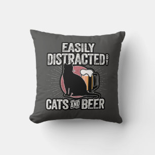 Easily Distracted by Cats and Beer Cushion