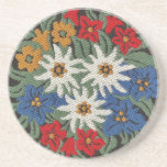 Edelweiss Swiss Alpine Flower Coaster<br><div class="desc">An image of a floral pattern with a needlework look of Edelweiss white Alpine flowers of Europe on your product. Blue,  red,  yellow,  and white colors. Leontopodium alpinum of Switzerland,  Germany,  and Austria.</div>