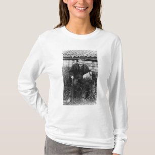 Edward Bingham holding one of his Castle T-Shirt