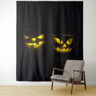 Eerie yellow glow pumpkin faces on black  tapestry