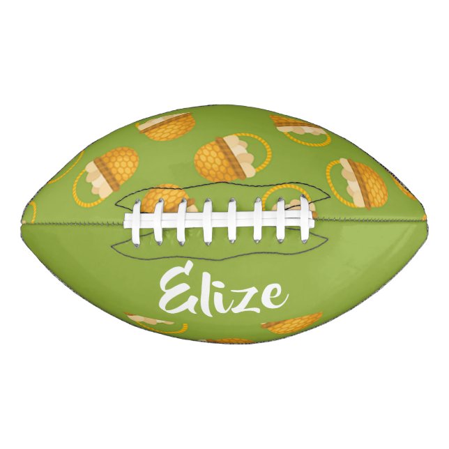 Eggs in brown basket on green american football (Front)