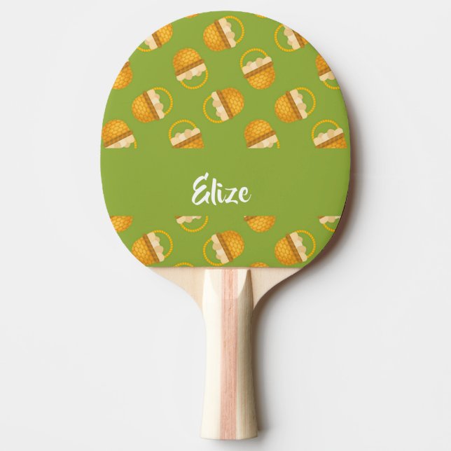 Eggs in brown basket on green ping pong paddle (Front)