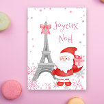 Eiffel Tower and Santa Pink Paris Christmas Holiday Card<br><div class="desc">This beautiful Paris themed Christmas card is full of whimsy featuring a pink Christmas theme. The Eiffel tower is adorned with a cute pink boy and a lovely Santa Claus is holding a sweet pink present. The scene is filled with falling pink and silver snowflakes. "Joyeux Noel" is the holiday...</div>