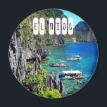 El Nido in Palawan Philippines Magnet<br><div class="desc">The ordinariness of El Nido only heightens the contrast between the mundane and the sublime. Spanish for ‘the nest’, El Nido is the gateway to the fabulous Bacuit Archipelago. The town, sandwiched between towering limestone karst cliffs and Bacuit Bay, is cluttered with buildings that creep onto the beach and businesses...</div>