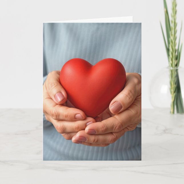 Elderly Woman Holding a Red Heart Card (Front)
