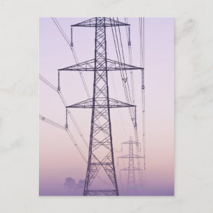Electricity pylons in mist at dawn. postcard