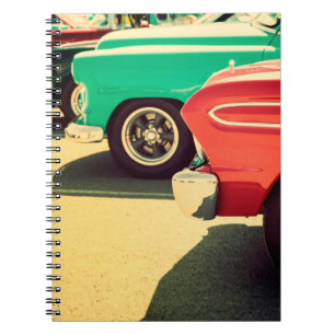 Electronic musical keyboard synthesizer with white notebook