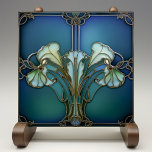 Elegant Art Nouveau Iris Bloom Ceramic Tile<br><div class="desc">Embrace the timeless elegance of Art Nouveau with this exquisite ceramic tile, featuring a stylised iris bloom design that captures the essence of the movement's organic forms and intricate contours. The serene aquamarine background harmonises with the delicate shades of mint green and seafoam, accented by the sophisticated outlines in antique...</div>