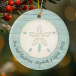 Elegant Beach Sand Dollar Photo First Christmas Ceramic Tree Decoration<br><div class="desc">A joyful Christmas ornament with a sand dollar and a weathered wood background for your 1st Christmas Celebration. Great for newlyweds. Put a beach honeymoon photo on the back. Personalize the front with your names and the year. Designed for you by Blackberry Boulevard.</div>