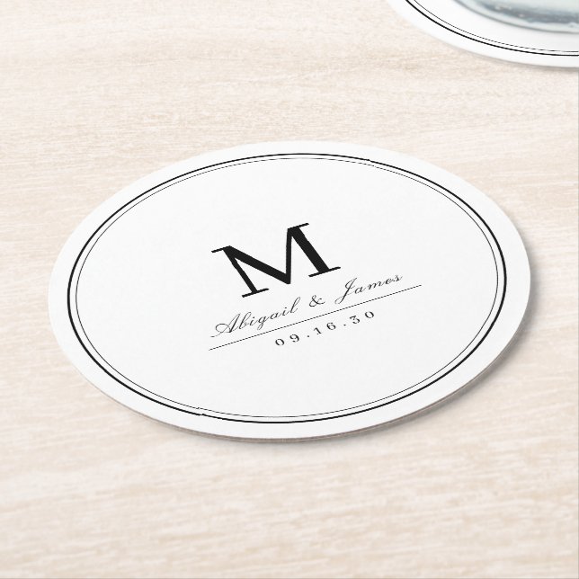 Elegant black and white minimalist monogram round paper coaster (Angled)