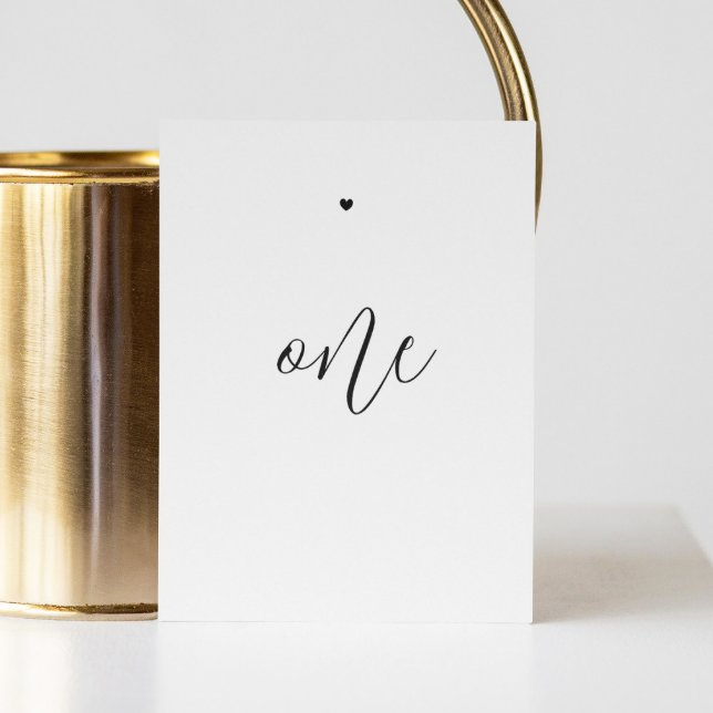 Elegant black and white minimalist script wedding table number (Creator Uploaded)