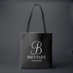 Elegant Black and White Personalised Bridesmaid Tote Bag<br><div class="desc">Elegant Black and White Personalised Bridesmaid Gifts
featuring personalised monogram in elegant calligraphy font style with bridesmaid's name and title in classic serif font style.

Also perfect for Maid of Honour,  Flower Girl,  Mother of the Bride and more.</div>
