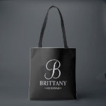 Elegant Black and White Personalised Bridesmaid Tote Bag<br><div class="desc">Elegant Black and White Personalised Bridesmaid Gifts
featuring personalised monogram in elegant calligraphy font style with bridesmaid's name and title in classic serif font style.

Also perfect for Maid of Honour,  Flower Girl,  Mother of the Bride and more.</div>