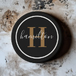 Elegant Black Brown Round Custom Monogram Initial Coaster<br><div class="desc">Elegant round personalised beverage drink coaster design features a classic custom serif monogram initial in rich cognac tan brown with your last name in modern white calligraphy script against a clean white background. A simple white circle frames the design. Colour scheme can be customised to coordinate perfectly with your home...</div>