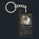 Elegant Black Photo Wedding Anniversary Calendar Key Ring<br><div class="desc">Give a truly personalised wedding anniversary gift with these elegant custom calendar keychain. The front design features a simple, modern black and white calendar which can be easily personalised with the names of the couple, monogram and the wedding date. And don't forget to move the heart to surround the wedding...</div>