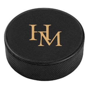 Elegant Black Puck with Gold Monogram Lettering